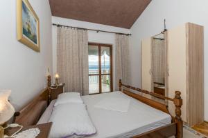 Posteľ alebo postele v izbe v ubytovaní Apartments Neno