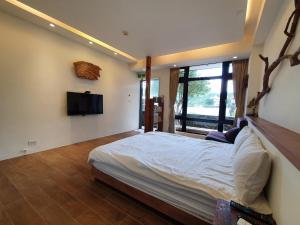Letto o letti in una camera di Chien Ching B&B
