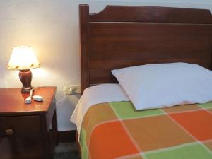 Postel nebo postele na pokoji v ubytování Hostal La Cazihita