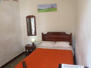 Postel nebo postele na pokoji v ubytování Hostal La Cazihita