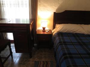 Postel nebo postele na pokoji v ubytování Hostal La Cazihita