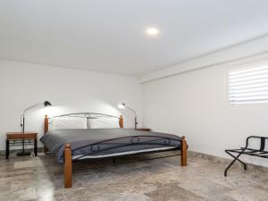 A bed or beds in a room at Across The Road From The Beach inlet side
