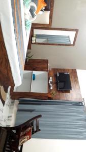 an overhead view of a room with a bed and a table at Milan Palace Deoghar in Deoghar