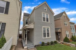 a gray house and a brown house at Recently Renovated Home in the Heart of Bellevue! home in Bellevue