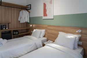 A bed or beds in a room at Alexandros