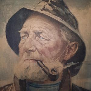 a painting of a man with a beard and hat at Tiny Villa de Haas met Infraroodsauna in Egmond aan Zee