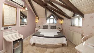 Postelja oz. postelje v sobi nastanitve Assos Behram Special Class Hotel Adults Only