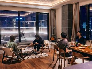 a group of people sitting at a table in a restaurant at 41 PIECES Sapporo in Sapporo +22 photos