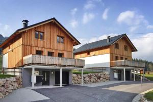 a large wooden building with a balcony at Chalet in Altaussee on Loser Ski Slopes in Lichtersberg