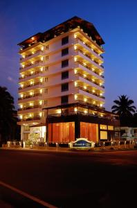 a large building with lights on the side of a street at Varanda Do Mar in Panaji