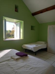 Krevet ili kreveti u jedinici u okviru objekta Gîte La Grange