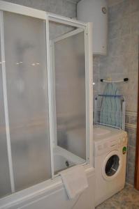 a washing machine and a washer in a bathroom at Apartment Milka - 150 m from sea in Biograd na Moru
