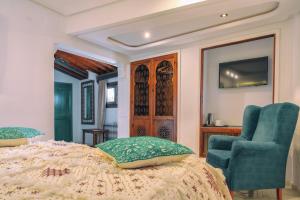 A bed or beds in a room at Casa Hassan