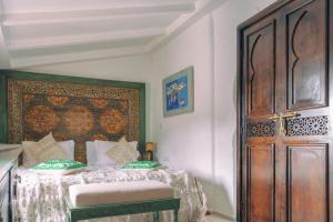 A bed or beds in a room at Casa Hassan