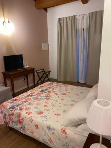 Postel nebo postele na pokoji v ubytování Albergo Diffuso Borgo Retrosi di Amatrice