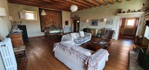a living room with a couch and a table at Corte Dei Frati in Affi
