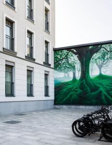 a mural of a tree on the side of a building at Moss Boutique Hotel in Moscow