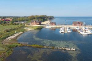 an aerial view of a marina with boats in the water at Bades Huk Marina Hotel in Hohen Wieschendorf