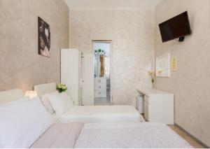 Letto o letti in una camera di Rome Place