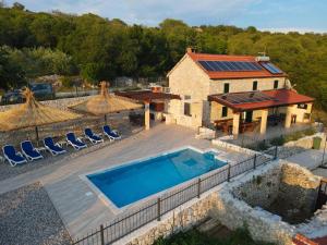 an aerial view of a house with a swimming pool at Villa Danica in Vid