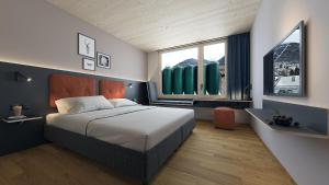 Postel nebo postele na pokoji v ubytování ALPSTADT LIFESTYLE Hotel