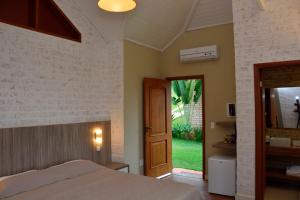 Postel nebo postele na pokoji v ubytování Hotel Pousada Água Da Mina