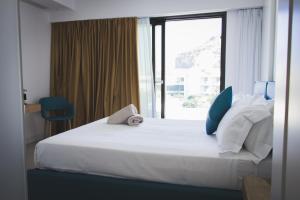 Кровать или кровати в номере Sunset Hotel