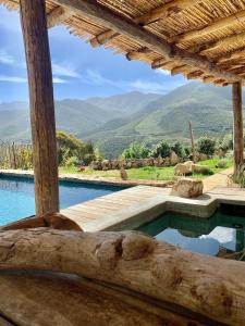 a swimming pool with a view of the mountains at CASA IB in Peri