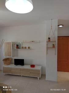 Telewizja i/lub zestaw kina domowego w obiekcie Apartamentos El Carmen