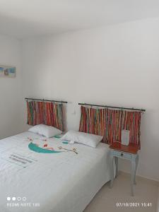 Łóżko lub łóżka w pokoju w obiekcie Apartamentos El Carmen