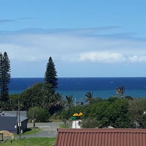 a view of the ocean from the roof of a house at Belavista, quaint and cozy cottage in Sunwich Port in Port Shepstone