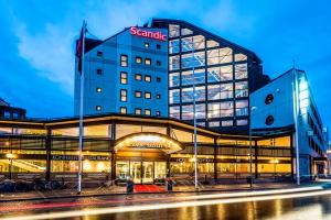 a building with a santander sign on top of it at Scandic Skellefteå in Skellefteå