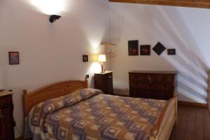 Giường trong phòng chung tại Arriga Alta