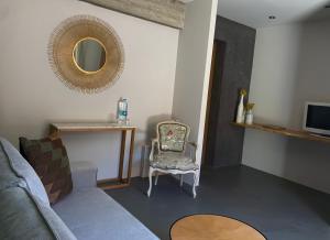 a living room with a couch and a mirror at CASA IB in Peri
