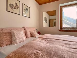 Voodi või voodid majutusasutuse Casa Cadore toas