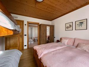 Voodi või voodid majutusasutuse Casa Cadore toas