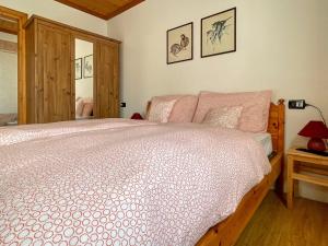 Voodi või voodid majutusasutuse Casa Cadore toas