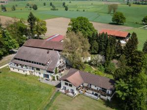 an aerial view of a large house with a roof at Pension Gut Horn in Waging am See