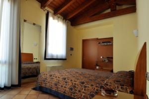 Postel nebo postele na pokoji v ubytování Locanda Baraca