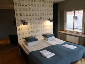 Cama o camas de una habitación en Uppsala CityStay Hotel