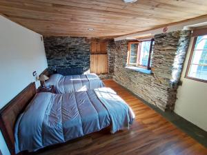 Tempat tidur dalam kamar di Mirador del Navia