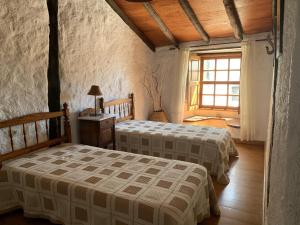 Postel nebo postele na pokoji v ubytování Casa rural las perez