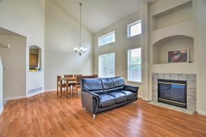 a living room with a couch and a fireplace at Family Home with Fenced Yard 15 Mi to Denver! in Broomfield