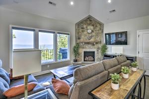 a living room with a couch and a fireplace at Scenic Sanctuary in Lookout Mountain with Views! in Trenton