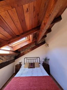 A bed or beds in a room at El Invernal de Picos