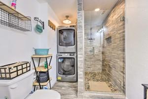 a washing machine in a bathroom with a shower at Hilltop Hideaway Branson Home with Trampoline! in Branson +29 photos