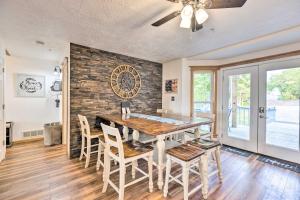 a dining room with a table and chairs at Hilltop Hideaway Branson Home with Trampoline! in Branson