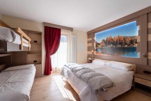 Posteľ alebo postele v izbe v ubytovaní Berg Hotel Latemar Spitze