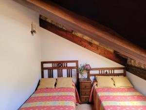 A bed or beds in a room at El Invernal de Picos