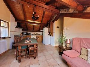 
a living room filled with furniture and a table at El Invernal de Picos in Portilla de la Reina
